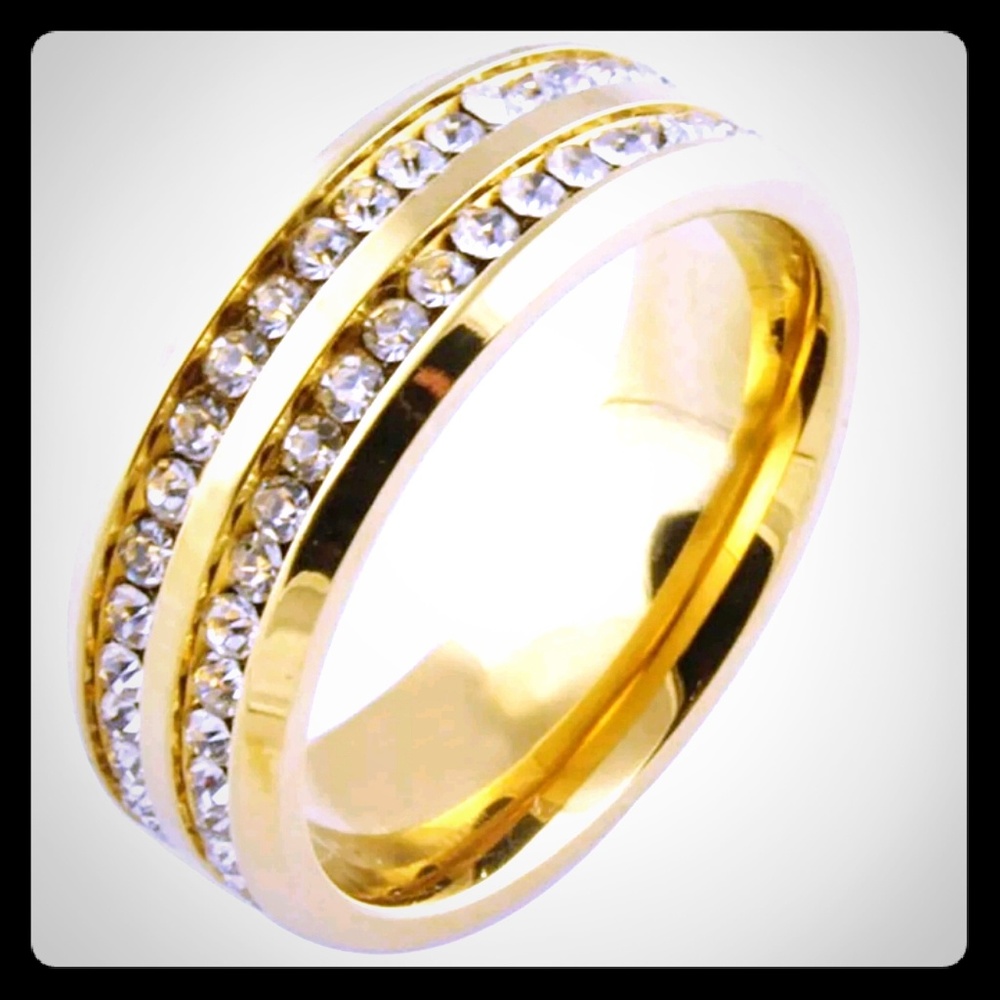 14kt Gold Titanium band. Zircon Embedded stones.